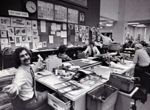 Howard Finberg, foreground, at the Chicago Tribune graphics desk in 1977